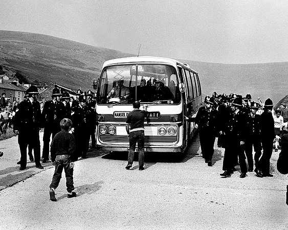 NUM committee man Jeff Jones tries to stop a bus carrying a strikebreaker. Blaengarw, August 1984