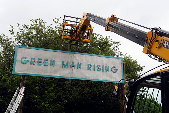 Green Man Rising sign going up