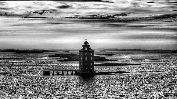 Kjeungskjær lighthouse is the only octagonal lighthouse in Norway.  in Norwegian fjords between Bergen and Tromso. Copyright: Cardiff photographer Richard Williams