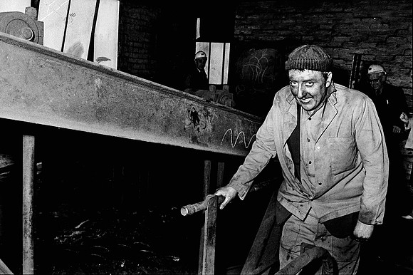 Washery worker Deri Jenkins on the steel stairway at Maesteg Washery, 1985