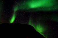 The Northern Lights, Aurora Borealis from the deck of Hurtigruten's Kong Harald sailing through fjords near Tromso