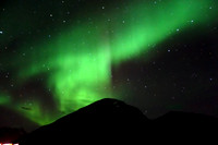 The Northern Lights, Aurora Borealis from the deck of Hurtigruten's Kong Harald sailing through fjords near Tromso