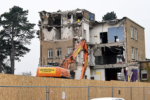 A digger at work on the last of the Ty Oldfield building